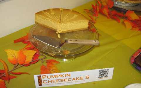 Pumpkin Cheesecake—Prototype 5, at dessert table ("For Your Information"/"Scan me!")